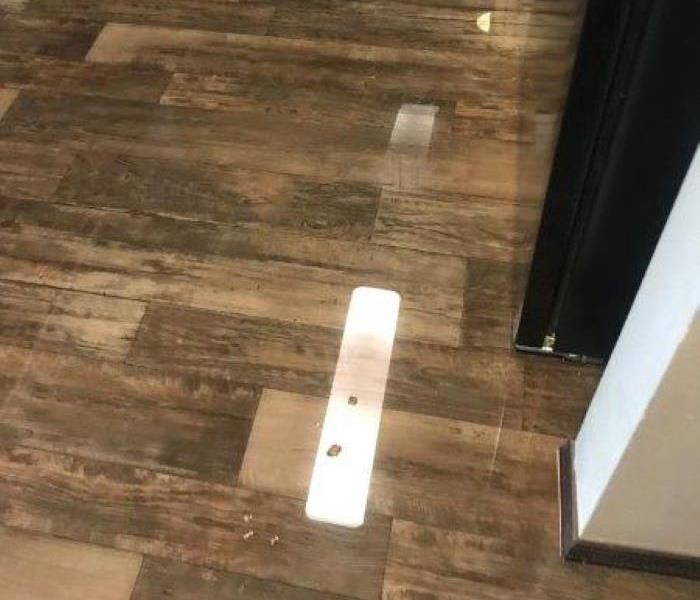 Water covered wood floor
