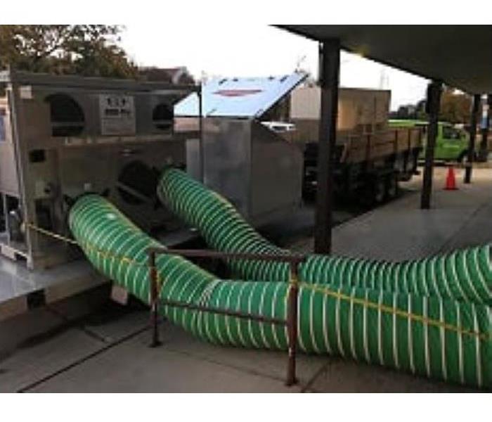 Trailer mounted desiccant with hoses into building